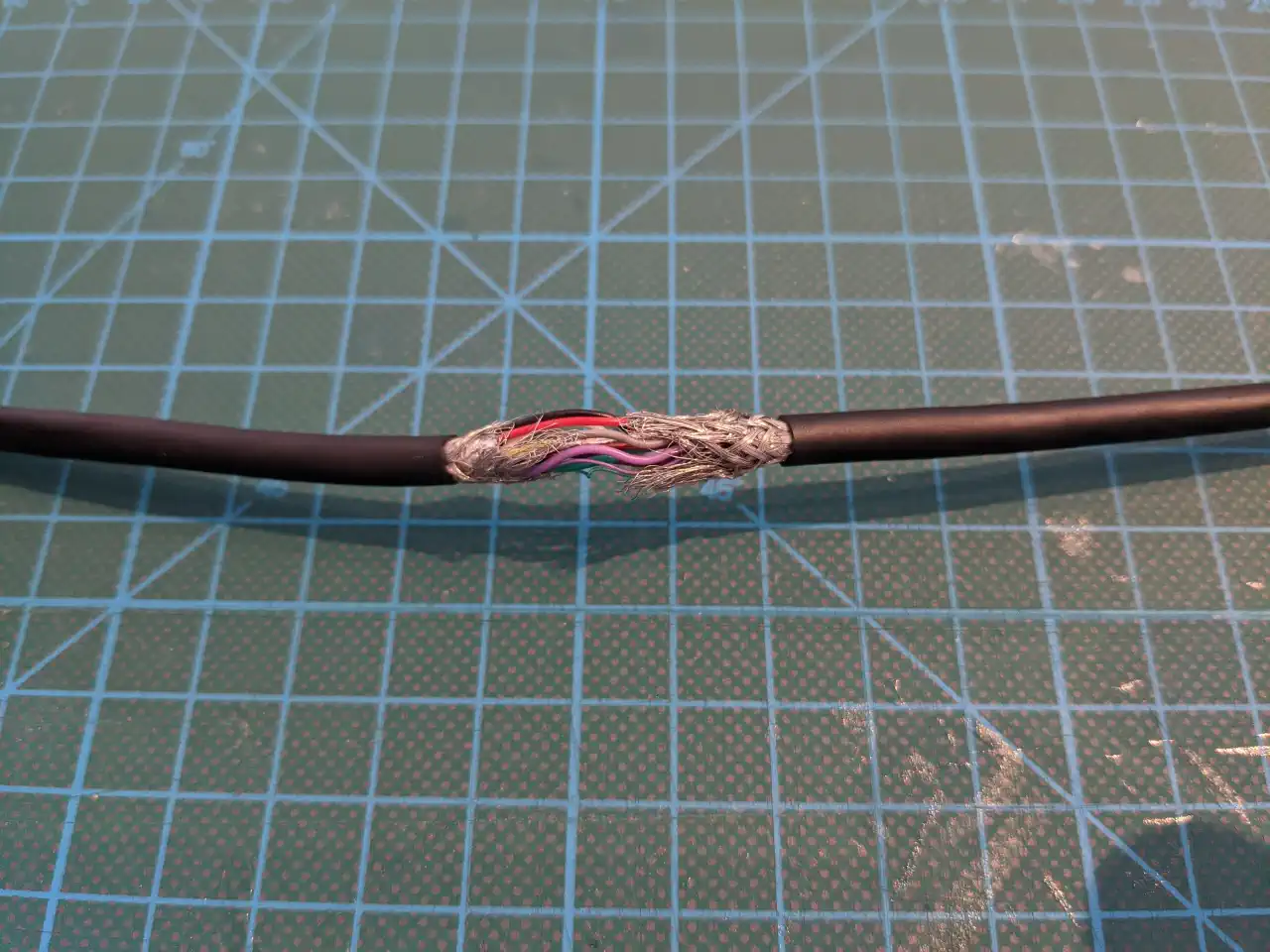 The cable with some insulation removed
